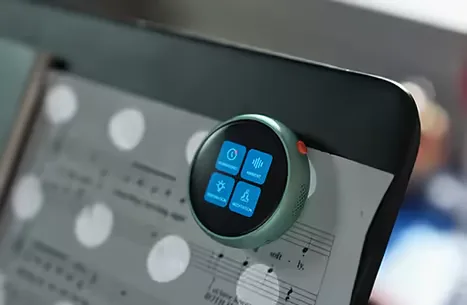Tikpal clipped beside sheet music on a tablet, capturing while you play